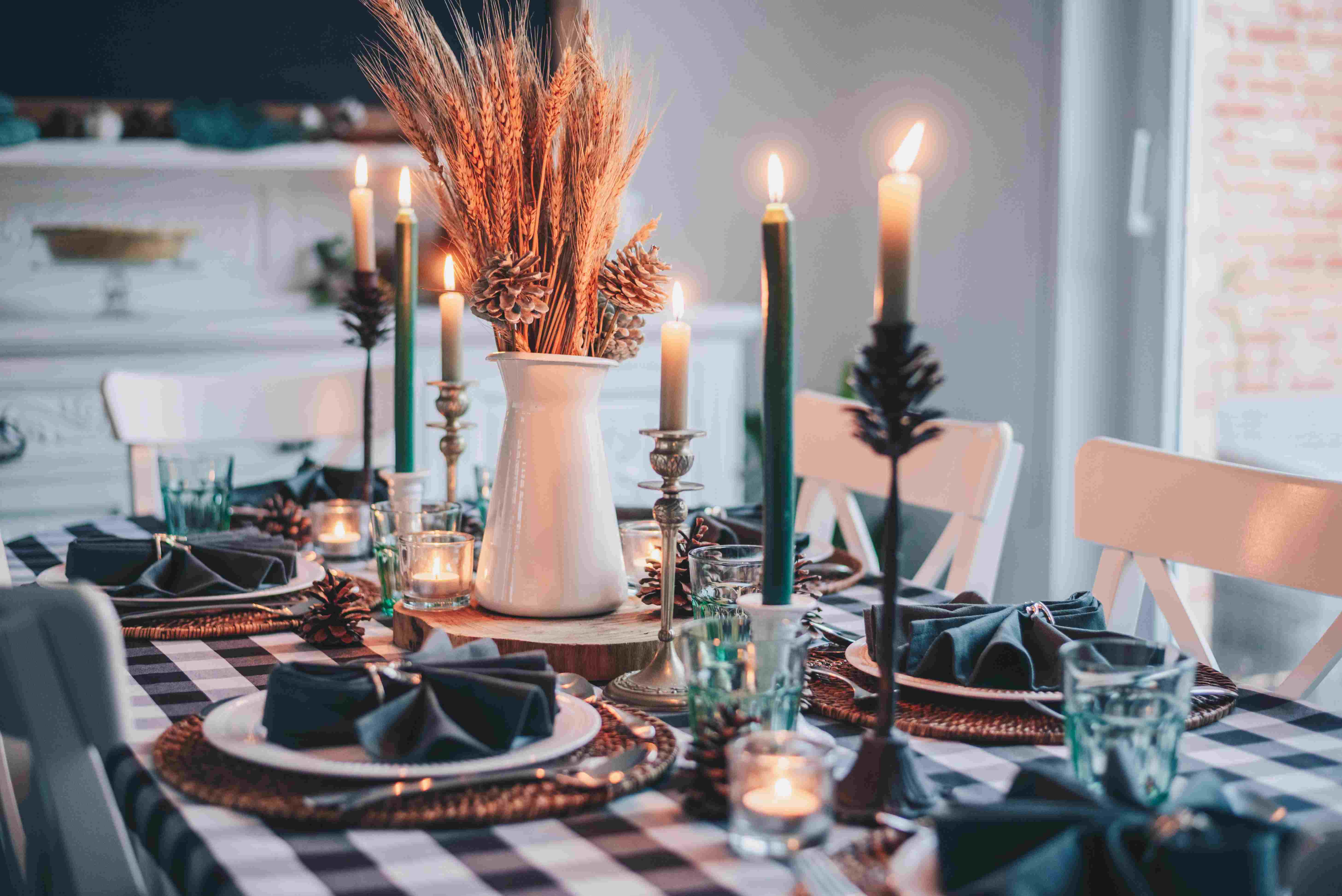 a beautifully set Thanksgiving table with candles